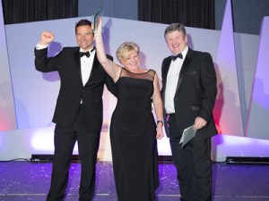 South Wales Chamber of Commerce Welsh Business Awards Winner on stage accepting award