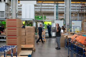 Workers in a busy warehouse environment